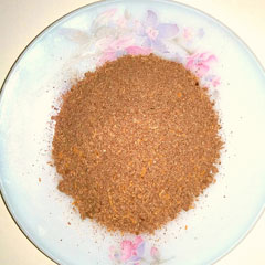 Brown powdered cattle feed
